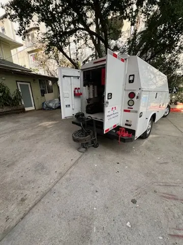 Magnet Plumbing service vehicle on-site for Grease Trap Cleaning in Holiday Hills